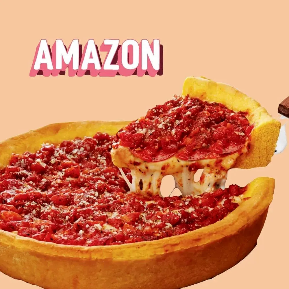 A cheesy slice of deep dish pizza lifted from the pan, next to the Amazon logo