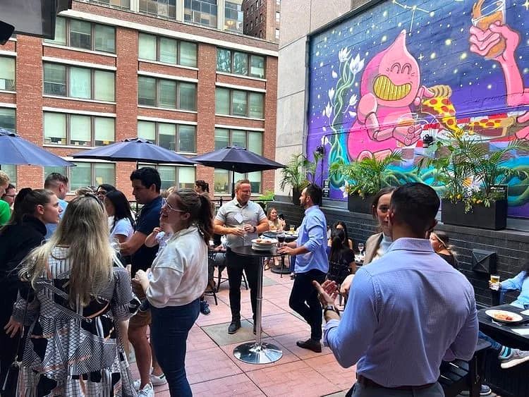 People gathered at the outdoor rooftop terrace at Gino’s East Magnificent Mile